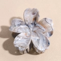 Detail view of flower hair claw clip with grey and white marble texture and sturdy teeth - Gray