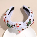 Close-up of white knitted Christmas headband with Santa and colorful rhinestones - Santa Claus White