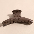 Detail of coffee brown large hair claw clip with heart patterns and LOVE text print - Heart Coffee