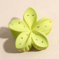 Close-up of matte light green flower hair claw with sparkling rhinestone petal details - Light Green