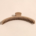 Detail view of large matte khaki shark hair claw clip for thick hair styling - Khaki