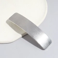 Detail of silver alloy hair clip featuring a refined brushed metal texture and linear finish - Square Heart Silver