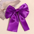 Elegant purple satin double-layered bow hair clip with long ribbons on a beige surface - Deep purple