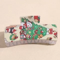 Detalle de pinza para el pelo con estampados navideños de Papá Noel sobre fondo beige - Árbol Muñeco De Nieve Animado