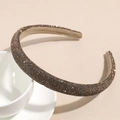 Close-up of sparkling coffee brown rhinestones on a thick padded sponge headband - Rose Gold