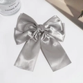 Detail showing grey satin double-layered bow hair clip with elegant long ribbons - Light Gray