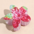 Detail view of large ABS floral hair claw clip with pink and green gradient spray finish - Red and Green