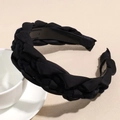 Dettaglio del cerchietto intrecciato nero con trama a treccia e design interno antiscivolo - Nero
