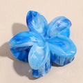 Detailed top view of blue marble pattern flower hair claw with elegant glossy texture - Gradient Blue