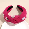 Nahaufnahme von rosa verknotetem Haarreif mit 3D-Herzanhängern und LOVE-Prägung - Fuchsia