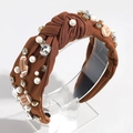 Detail view of retro football headband with faux pearls and rhinestones on brown fabric - Dark Brown
