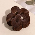 Detail of a brown flocked plumeria hair claw with check patterns and metal spring - Hollow Brown Flower