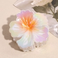 Macro detail of the iridescent flower hair claw clip with pearlescent marble texture - Orange