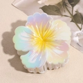 Detail shot of multi-color gradient acetate flower hair claw clip with iridescent finish - Yellow