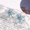 Macro shot of blue resin flower earrings with crystals and gold metal base detail - Single Flower Style / 1 Pair Pack / Blue