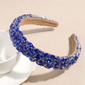 Detailed view of the wide baroque headband with deep blue rhinestones near a coffee cup - Blue