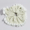 Close-up of light green linen scrunchie with white organza ruffled edges and layered texture - Light Green