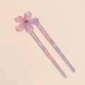 Detail of a lilac acetate U-shaped hair pin with a sparkling pink floral rhinestone - Pink Purple