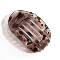 Detail of tortoise shell claw clip with oval hollow design and gold metal spring - Translucent Grey Purple Leopard