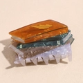 Detailed view of book-shaped hair claw clip in colorful acetate with maple leaf pattern - Book Hair Claw