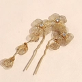 Detail of gold floral hairpins with tassel and rhinestones in traditional style - Gold
