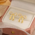 Elegant gold bow earrings with crystal zircon inlay on a pink velvet jewelry box - Gold Bowknot Style (es81)