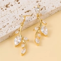 Elegant gold willow leaf earrings with cubic zirconia tassels on a textured stone base - Gold Branch Style (es108)