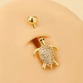Golden sea turtle belly button ring with pavé-set zircons on skin-tone silicone model - Gold