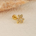Macro shot of clover-shaped stud earring with cubic zirconia and screw ball back - Gold Clover Sakura