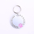 Silver round pet ID tag with sparkling rhinestones and a pink paw print design - 25mm / Pink