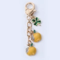 Creative alloy keychain with green clover and yellow rhinestone apple pendants - Yellow Rhinestone Apple Clover (01)