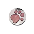 Close-up of circular metal pet tag with pink glitter paw print and polished silver finish - 25mm / Light Pink
