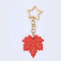 Glitzernder roter Ahornblatt-Acryl-Schlüsselanhänger mit goldenem Sternenverschluss - Rote Ahornblätter
