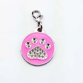 Close-up of pink enamel paw print pet ID tag with sparkling rhinestones and lobster clasp - Claw Print / Pink