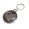 Detailed view of a round silver pet ID tag with red glitter background and double hearts - 25mm / Red