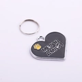 Detail of heart-shaped zinc alloy pet ID tag with black enamel and MEJOR AMIGO text - Black Heart