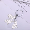 Detailed close-up of three white enamel Sphynx cat charms on a silver metal keychain - 9cm / Siamese Cat