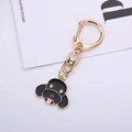 Llavero de perro en esmalte negro con anilla de metal dorado elegante para amantes de perros - Caniche
