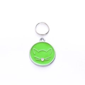 Macro view of round green enamel pet ID tag with cat face outline and silver ring - 25mm / Green