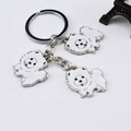 Silver metal keychain featuring three white enamel cartoon dog charms in a flat lay view - 12cm / White Charms Set