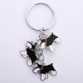 Detail eines Schnauzer-Schlüsselanhängers aus Zinklegierung mit drei süßen Hundefiguren - Schwarz Serie