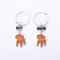 Dettaglio di portachiavi Best Friends con ciondoli a forma di barboncino marrone - Cane Teddy