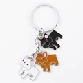 Dettaglio di tre portachiavi bulldog francese in smalto nero, marrone e bianco su anello - Stile Trio Pendente Bulldog Nero Marrone Bianco Misto