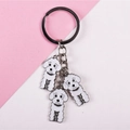 Porte-clés mignon avec poodles blancs de dessin animé et breloques émaillées sur fond rose - Chaîne Triple Chiens Blancs / Blanc