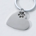 Polished heart shaped stainless steel keychain with animal paw print cutout detail - Heart