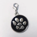 Detail of round pet tag pendant with paw print, cat and dog design and lobster clasp - 25mm / Black