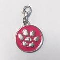 Detail of round rose pink enamel pet tag with paw print and animal silhouette - 25mm / Rose Red