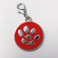 Detail view of red enamel pet tag with silver paw print and lobster clasp attachment - 25mm / Red