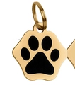 Macro detail of paw-shaped golden stainless steel pet ID tag with black enamel inlay - 2.5cm 4g / Gold