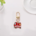 Detail of cute cartoon fire truck keychain with gold hook on clean white background - Fire Truck